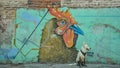 07/07/2018, Culiacan, Sinaloa, Mexico: A dog with a bandana sits in front of a rooster.