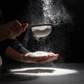 Culinary Art - Sifting Flour in Dramatic Light Royalty Free Stock Photo