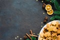 Culinary background with freshly baked Christmas gingerbread, spices and fir branches. Copy space. Royalty Free Stock Photo