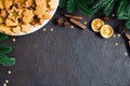 Culinary background with freshly baked Christmas gingerbread, spices and fir branches Royalty Free Stock Photo