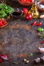 Culinary background with kitchen stone surface, olive oil in a jug and vegetables. Empty space for menu or recipe.