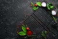 Culinary background with spices, herbs and kitchen utensils. Top view. Rustic style Royalty Free Stock Photo