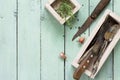 Culinary background. Vintage kitchen utensils, garlic and rosemary on a wooden kitchen table. Royalty Free Stock Photo