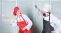 Culinary battle concept. Woman and bearded man culinary show competitors. Ultimate cooking challenge. Culinary battle of Royalty Free Stock Photo