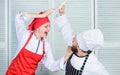 Culinary battle of two chefs. Couple compete in culinary arts. Kitchen rules. Who cook better. Culinary battle concept Royalty Free Stock Photo