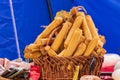 Culinary buffet with a presentation of a variety of healthy dishes - cheeses, sausages. Basket with smoked cheese sticks.