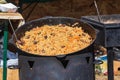 Culinary buffet with takeaway healthy food - plov, rice, meat, pepper, spices, grilled vegetables.