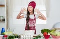 culinary and cuisine. happy childhood. happy child wear cook uniform. chef girl in hat and apron. kid cooking food in Royalty Free Stock Photo