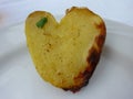A Culinary Delight: Heart-Shaped Roasted Potatoes on a White Plate, a Whimsical Creation by Nature