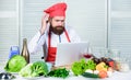 Culinary education online. Elearning concept. Man chef searching internet recipe cooking food. Chef laptop read culinary Royalty Free Stock Photo