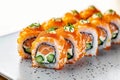 Culinary elegance Philadelphia rolls with salmon, cream cheese, cucumber tobiko Royalty Free Stock Photo