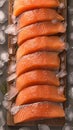 Culinary elegance Salmon fillets portioned on ice, clean kitchen board