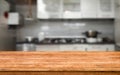 Culinary Elegance: Wooden Board Empty Table Background with Blurred Kitchen Ambiance