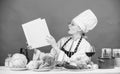 Culinary expert. Woman chef cooking healthy food. Girl read book top best culinary recipes. Culinary school concept