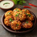 Culinary fusion Sabudana vada, a flavorful Indian dish with chutney Royalty Free Stock Photo