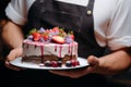 Culinary opulence expertly crafted mousse cake in the chefs hands