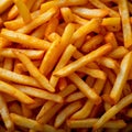 Culinary pleasure French fry chip background evokes tasty fast food joy