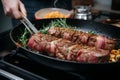 Culinary precision beef roll sizzling in a pan, close up view
