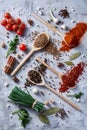 Culinary still life of assorted spices on white textured background, flat lay, close-up, selective focus. Royalty Free Stock Photo