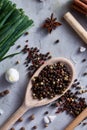 Culinary still life of assorted spices on white textured background, flat lay, close-up, selective focus, vertical. Royalty Free Stock Photo