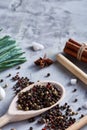 Culinary still life of assorted spices on white textured background, flat lay, close-up, selective focus, vertical. Royalty Free Stock Photo