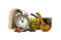 Culinary still life with clock, pot and berries