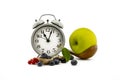 Culinary still life with clock, spoon and berries