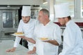 Culinary students learning how to prepare succulent pastries