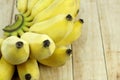 Cultivate Asian yellow banana on wood background.