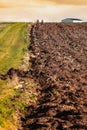 Cultivated field freshly ploughed by sunny day