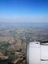 Cultivated ground and blue sky seen from plane