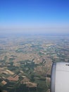 Cultivated ground and blue sky seen from plane