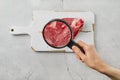 Cultured meat concept. Meat from beaker, top view Royalty Free Stock Photo