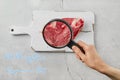 Cultured meat concept. Meat from beaker, top view Royalty Free Stock Photo