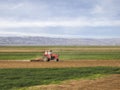 Cultivating tractor in the field - spring time Royalty Free Stock Photo
