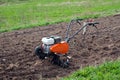 Cultivator on field. Royalty Free Stock Photo