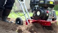 Man working with garden tiller engine in 4K VIDEO