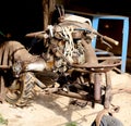 Cultivator old and rusty abandoned in a garage of the farm stora