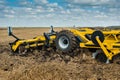 Cultivator, close up of a disc harrow on a field background Royalty Free Stock Photo