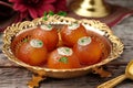 Cultural indulgence Gulab Jamun served in a classic metal bowl