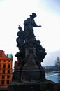 Cultural monument and ancient ruin antique stone statue on Charles Bridge crossing Vltava Moldau river for Czechia people and