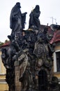 Cultural monument and ancient ruin antique stone statue on Charles Bridge crossing Vltava Moldau river for Czechia people and