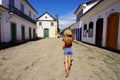 Cultural tourism in Brazil. Travel woman walking towards the chapel of Nossa Senhora dos Remedios e Sao Benedito in the historic