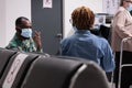 Culturally close patients chatting at family area of infirmary