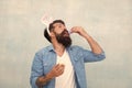 Culture customs and traditions. Easter bunny colored eggs. Celebration of spring holiday. Bearded man bunny ears and