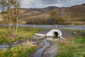 Culvert located under the road. Russia Royalty Free Stock Photo