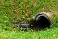 Culvert pipe hole system draining sewage water with little puddl Royalty Free Stock Photo