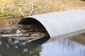 Culvert Pipe Under Road From Stream Oxbow in Park