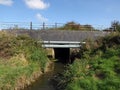 Drain culvet running below railway bridge Royalty Free Stock Photo