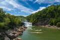 Cumberland Falls with a blue sky with clouds in Corbin, Kentucky, USA Royalty Free Stock Photo